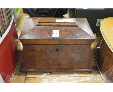 A Victorian burrwood sarcophagus shaped tea caddy.