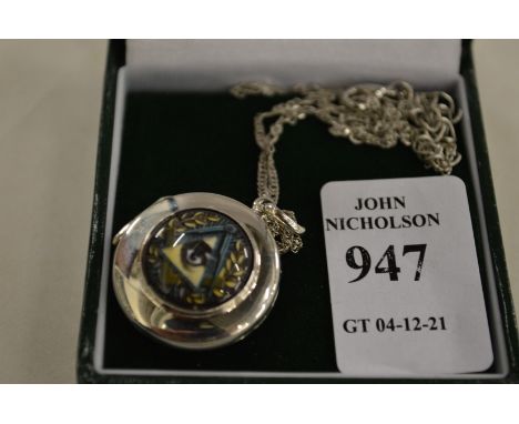 A decorative pendant and chain.