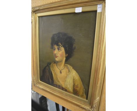 A portrait of a youth, oil on canvas, in a decorative gilt frame.