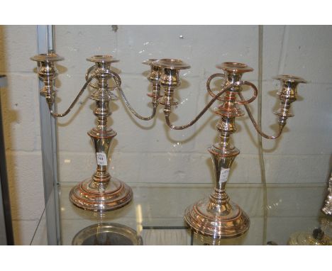 A pair of Old Sheffield Plate three light twin branch candelabra.