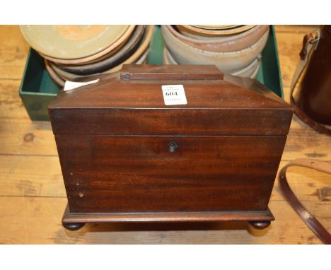 A Victorian mahogany tea caddy.
