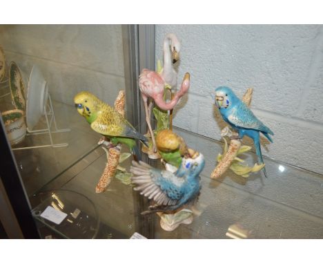 A group of Goebel models of budgies and flamingos.