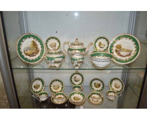 A late 19th century topographical tea service, each item painted with a different landscape and buildings.