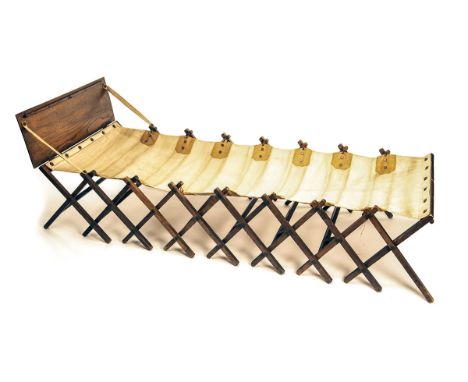 W. & S.A VINTAGE MILITARY OFFICER'S CAMPAIGN BED,solid oak scissor folding frame, canvas mattress, brass plaque with 'W&S' tr