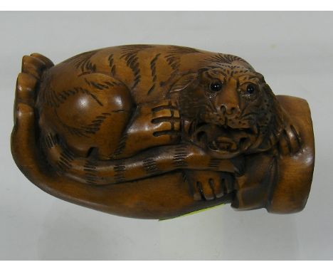 An Oriental Carved Wood Netsuke Of Tiger