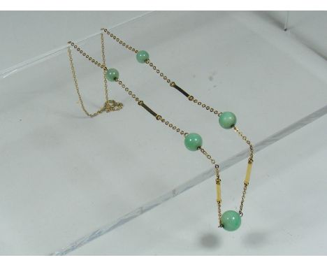 A Ladies 9ct Gold Necklace With Jade Beads