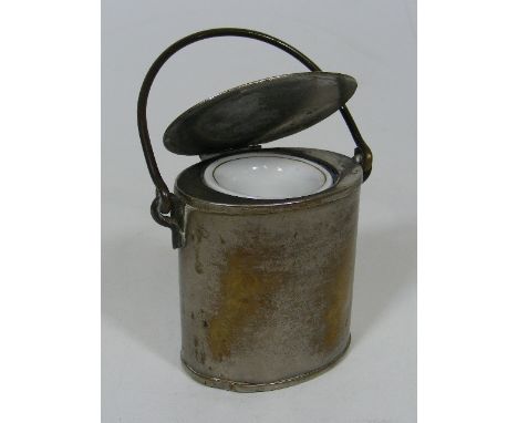 An Antique Can Inkwell With Ceramic Liner