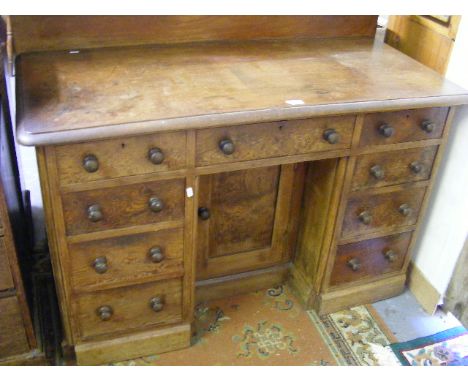 An Antique Knee Hole Desk With Nine Drawers