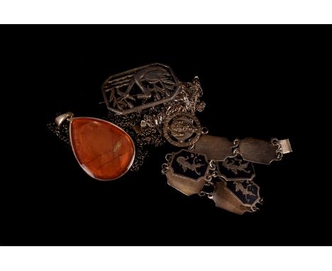 A vintage Swedish silver brooch, pierced with two swans on lake, together with an enamel penant on chain, two white metal cha