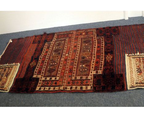 A vintage Turkomen sampler rug or carpet, with both flat and raised weaved areas, 204cm by 104cm
There are no obvious signs o