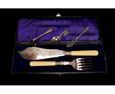 A cased pair of silver plated fish servers, together with two cigarette holders, one with silver tip, the other with yellow m