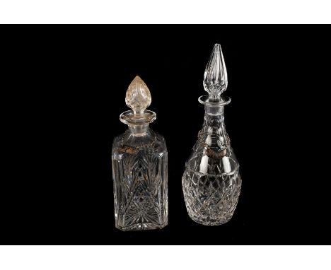 A Cut Glass Ships decanter, together with three further cut glass examples with name lables, Gin, Sherry and Whisky.