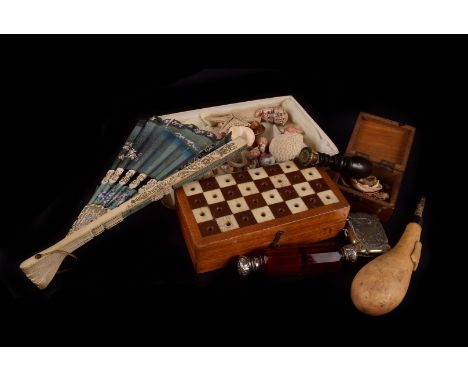 A collection of miscellineous items, to include an assortment of sea shells, a chess set, vestas, bottle tops, double ended s