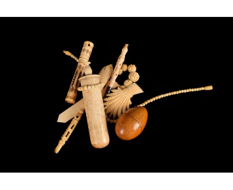 A collection of 19th century and later bone items, including a Stanhope needle case of Jerusalem, sovereign scales,'The Brita