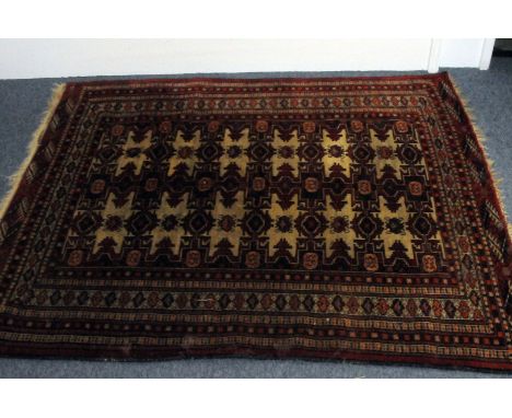 A Turkomen carpet, with multiple borders enclosing a geometric ground, 172cm by 150cm