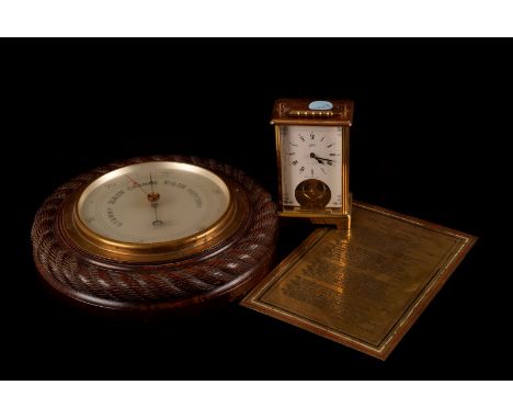 A brass carriage time piece, together with a wall barometer and a brass plaque (3)
