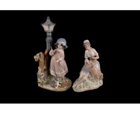 A group of modern Lladro and Nao porcelain figures, including a Lladro girl with rake and cat on lamp post base, no. 5286, al