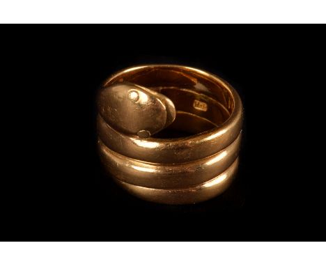 An 18ct gold serpent ring, marked Sheffield, by R.P, the serpent design winding round the finger, approx 12g
Ring size K 1/2 