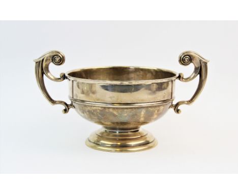 An Edwardian silver twin handled trophy, James Deakin &amp; Sons, Sheffield 1907, of typical plain polished form, scroll hand