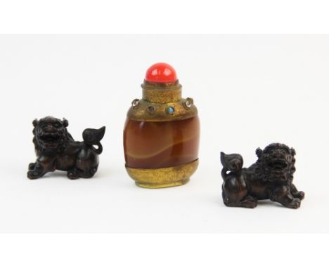 An early 20th century snuff bottle, the agate body mounted with yellow metal, decorated with foliate designs and set with sem