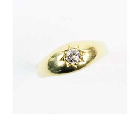 A diamond set gypsy style ring, comprising a central round old cut diamond approx. 3mm diameter, claw set in yellow metal to 
