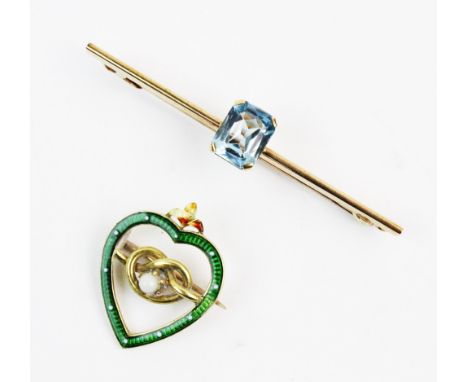 An Edwardian heart-shaped enamel brooch, comprising a central pearlescent cabochon claw set to a yellow metal 'Stafford Knot'