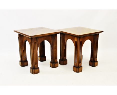 A pair of Gothic influence oak lamp or side tables, 20th century, the square tops centred with a cross banded 'X', raised upo