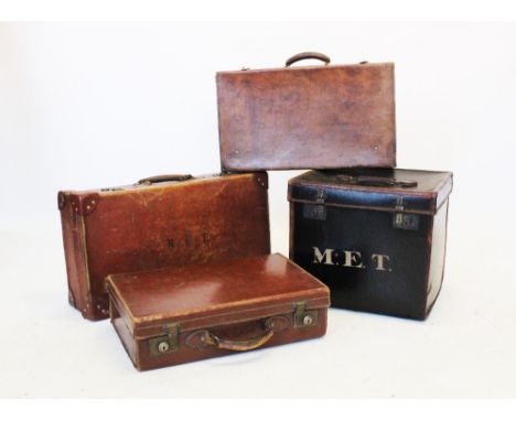 An early 20th century canvas trunk, of cubic form with leather trim and handles, 46cm wide, a vintage leather suitcase with l