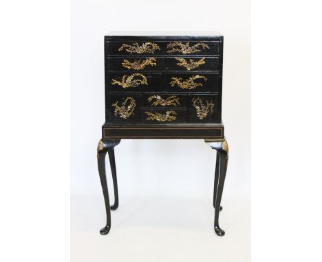 An early 20th century Japanned specimen chest on stand, the rectangular cabinet with an arrangement of eight assorted drawers