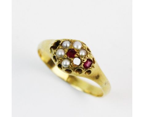 A Victorian pearl and ruby cluster ring, comprising two mixed cut rubies and five small pearls in a floral cluster design, al