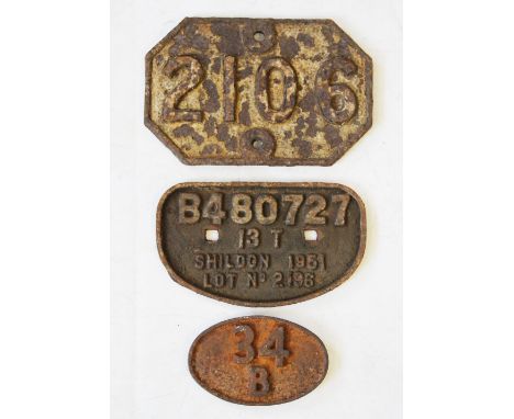 Three vintage cast iron engine and shed plates to include, 'B480727 13T Shildon 1951 Lot No. 2196' cast in relief, 26cm wide,