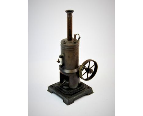 An early 20th century live steam model vertical  stationary engine, the cylindrical copper tank applied with the initials 'M.