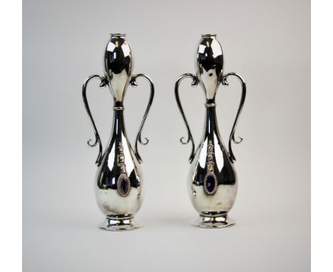 A pair of Art Nouveau Jugendstil silver plated vases, of thin waisted gourd form, each applied with a pair of scroll loop han