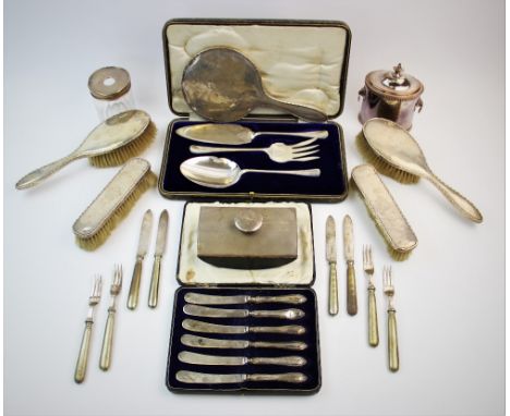 A silver backed dressing table set, Synyer &amp; Beddoes, Birmingham 1914, comprising: a hand mirror, two hair brushes, two c