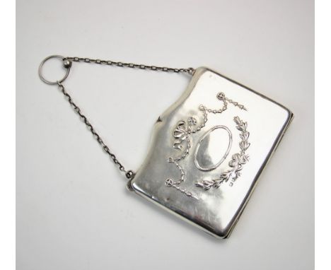 An Edwardian silver purse, Henry Matthews, Birmingham 1909, of typical form, with garland swag and bow tied detail, attached 