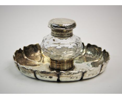 A Victorian silver mounted inkwell on silver stand, Charles Thomas Fox &amp; George Fox, London 1850, the moulded glass inkwe