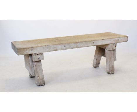 A 19th century slab top pig bench, the rectangular top on four angled legs of square section, 46cm H x 135cm W x 30cm D 