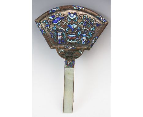 A 19th century Chinese champleve enamel mirror, the fan form back with polychrome enamelled design of treasures and foliage, 
