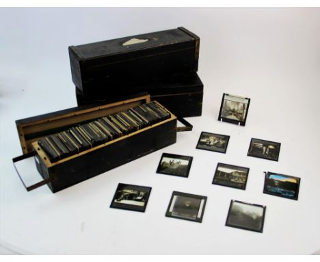 A large quantity of glass magic lantern slides, mid 19th century and later, depicting a range of topographical and historical
