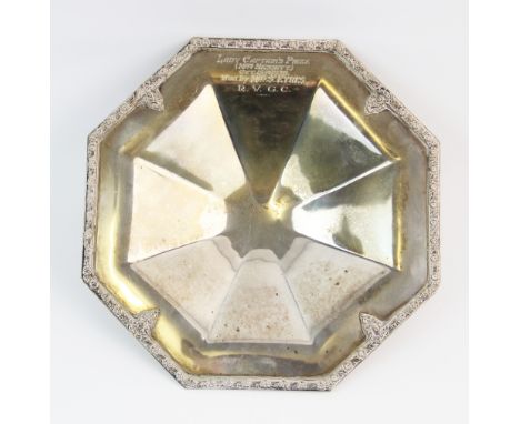 A silver dish, Roberts &amp; Belk Ltd, Sheffield 1960, of octagonal form, with foliate and floral raised border, engraved ?La