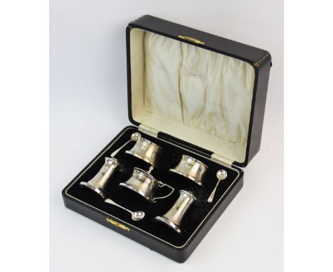 A silver Art Deco condiment set, Joseph Gloster Ltd, Birmingham 1934, each piece of waisted form, with engine turned detail, 