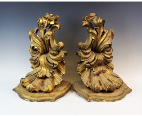 A pair of late 19th century gilt wood wall brackets, each with a shaped shelf upon a scrolling acanthus openwork support, 44c