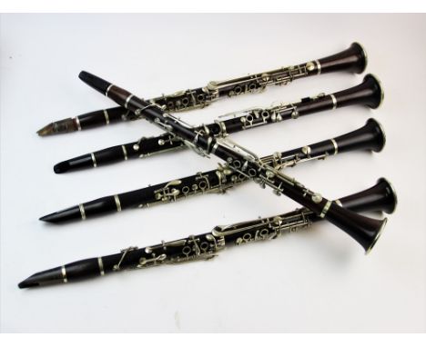A collection of five early 20th century and later rosewood coloured clarinets, comprising, an E J Albert (Brussels) clarinet,