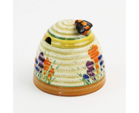A Clarice Cliff for Wilkinson Ltd Bizarre range Crocus pattern honey pot and cover, early 20th century, the pot of ribbed bee
