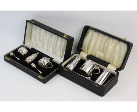 A silver cased condiment set, Adie Brothers Ltd, Birmingham 1956, comprising: a pepperette, a salt, a wet mustard and two spo