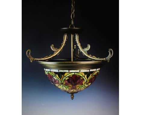 An early 20th century Tiffany style light fitting, of circular domed form, decorated in floral mosaic motif, fittings for thr