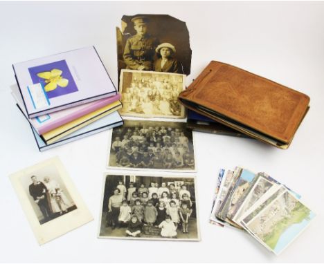 A collection of postcards to seven albums, early 20th century and later, to include military portrait cards from the 1st and 