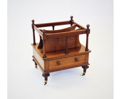 A Victorian mahogany Canterbury, with four spherical finials above a top rail, raised upon slender ring turned spindles, encl