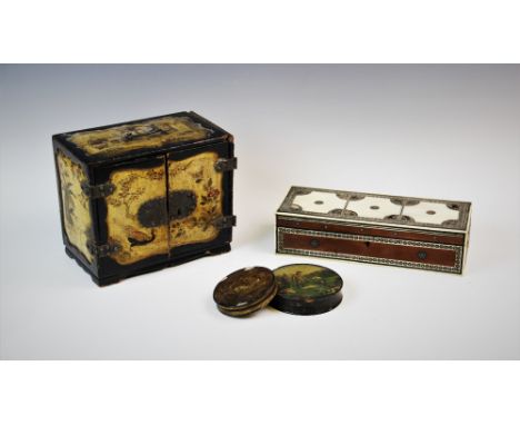 A Japanese lacquered Kodansu, Meiji period, decorated with flora, fauna and figural scenes, of rectangular form with two hing