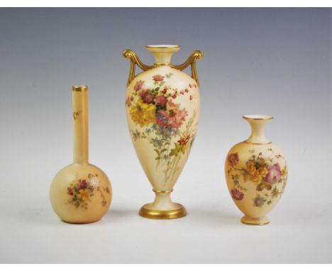 A Royal Worcester blush ivory twin handled stem vase, the vase of inverted baluster form with gilt scroll handles and foot ri